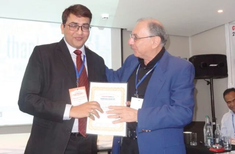 Certificate of honour presented on stage