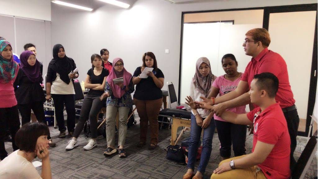 Demonstrating handling technique to participants